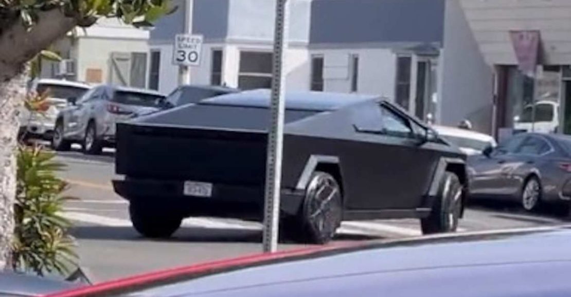 black wrapped cybertruck looks like batmobile